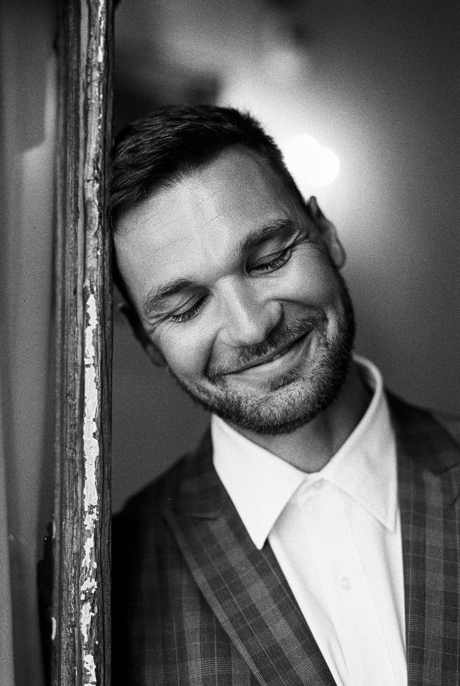 Smiling Man in a Black and White Portrait